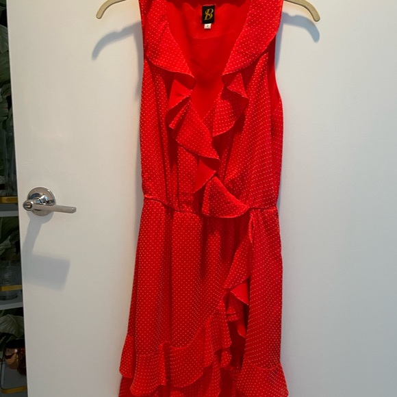 Cute red dress with small white polka dots and ruffle detailing. - Picture 2 of 3